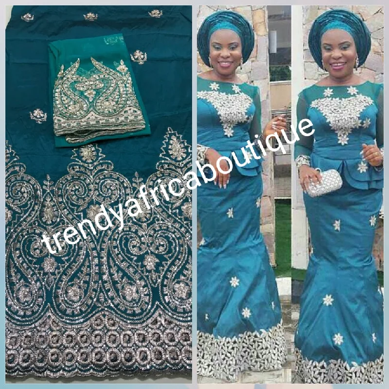 New arrival of Teal color Silk embroidery george. Embriodered with gold. Super quality Indian-George for making Aso-ebi dresses, Nigerian party dress. Contact us for group order. Sold as 5yds + 1.8yds matching net for blouse combo Lace Sexy Club New arrival of Teal color Silk embroidery george. Embriodered with gold. Super quality Indian-George for making Aso-ebi dresses, Nigerian party dress. Contact us for group order. Sold as 5yds + 1.8yds matching net for blouse combo Lace Sexy Club
